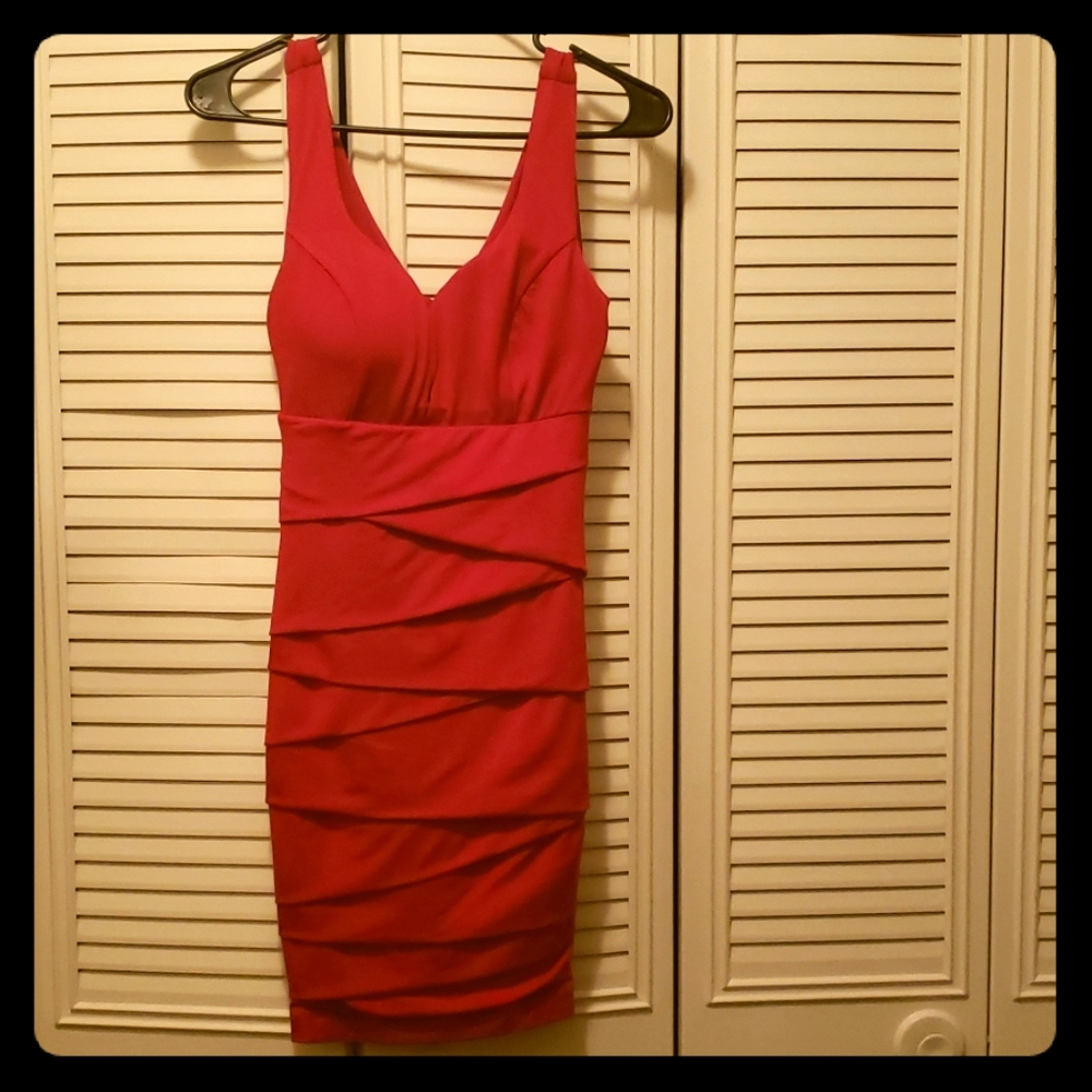 Low cut red dress.